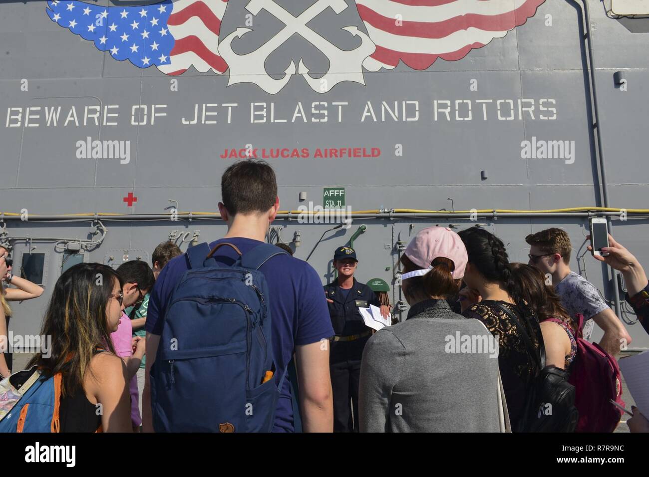 MAYPORT, Fla. (March 29, 2017) - Ens. Kimberly King leads students from the Department of Geography at University College London on a tour of the amphibious assault ship USS Iwo Jima (LHD 7). Iwo Jima recently returned to her homeport after conducting a series of certifications and qualifications in preparation for future deployments. Stock Photo