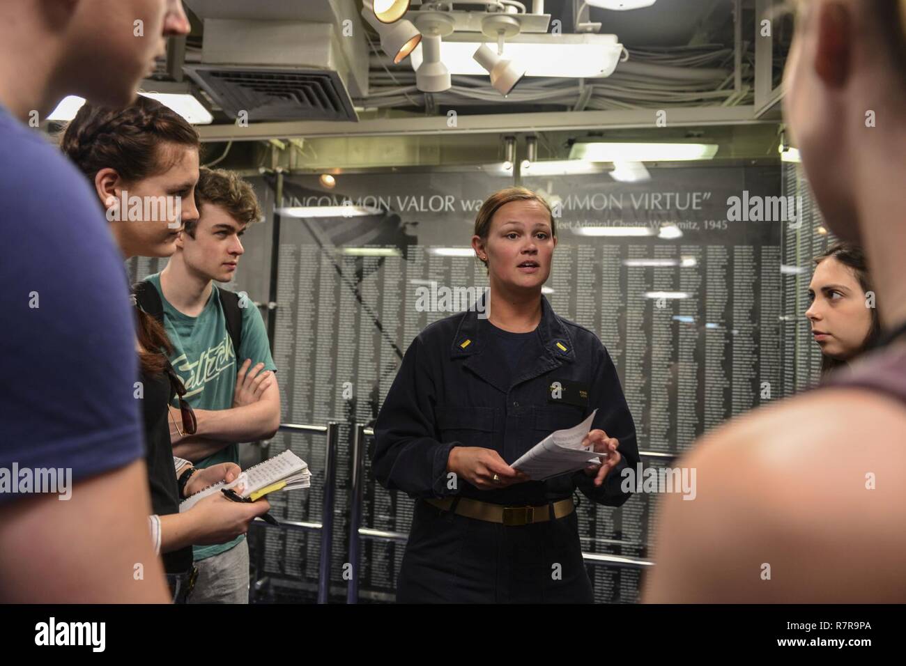 MAYPORT, Fla. (March 29, 2017) - Ens. Kimberly King leads students from the Department of Geography at University College London on a tour of the amphibious assault ship USS Iwo Jima (LHD 7). Iwo Jima recently returned to her homeport after conducting a series of certifications and qualifications in preparation for future deployments. Stock Photo