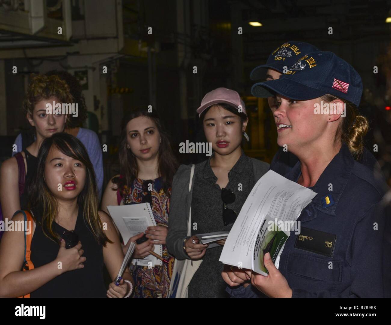 MAYPORT, Fla. (March 29, 2017) - Ens. Kimberly King leads students from the Department of Geography at University College London on a tour of the amphibious assault ship USS Iwo Jima (LHD 7). Iwo Jima recently returned to her homeport after conducting a series of certifications and qualifications in preparation for future deployments. Stock Photo