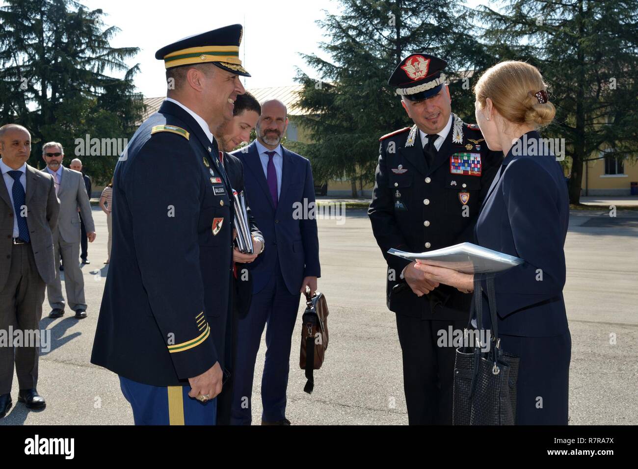 Brig. Gen. Giovanni Pietro Barbano, Center of Excellence for Stability Police Units (CoESPU) director (center) and U.S. Army Col. Darius S. Gallegos, CoESPU deputy director (left), salute Ms. Kelly Degnan, Charge’ d’Affaires ad interim U.S. Embassy & Consulates Italy,  during visit at Center of Excellence for Stability Police Units (CoESPU) Vicenza, Italy, Mar. 30, 2017. Stock Photo