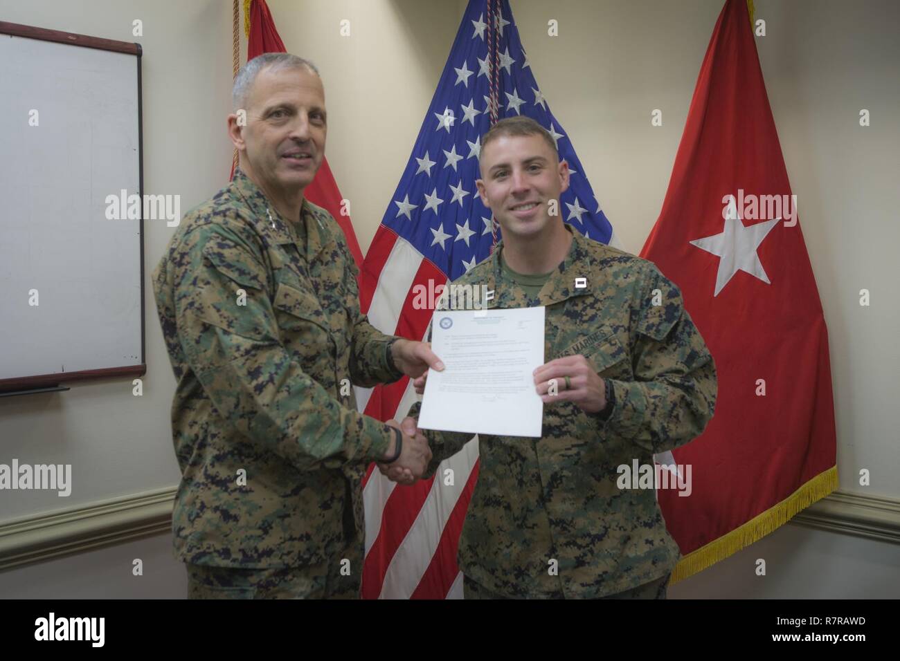 U.S. Marine Corps Lt. Gen. Michael G. Dana, deputy commandant, Installation and Logistics poses for a photo with Capt. Sean R. Wetherill, logistics officer, 1st Battalion 7th Marines at the Pentagon, Arlington, Va., March 23, 2017. Wetherill received the FY-16 1st Lt. Travis Manion Memorial Marine Corps Logistics Officer of the year award. Stock Photo