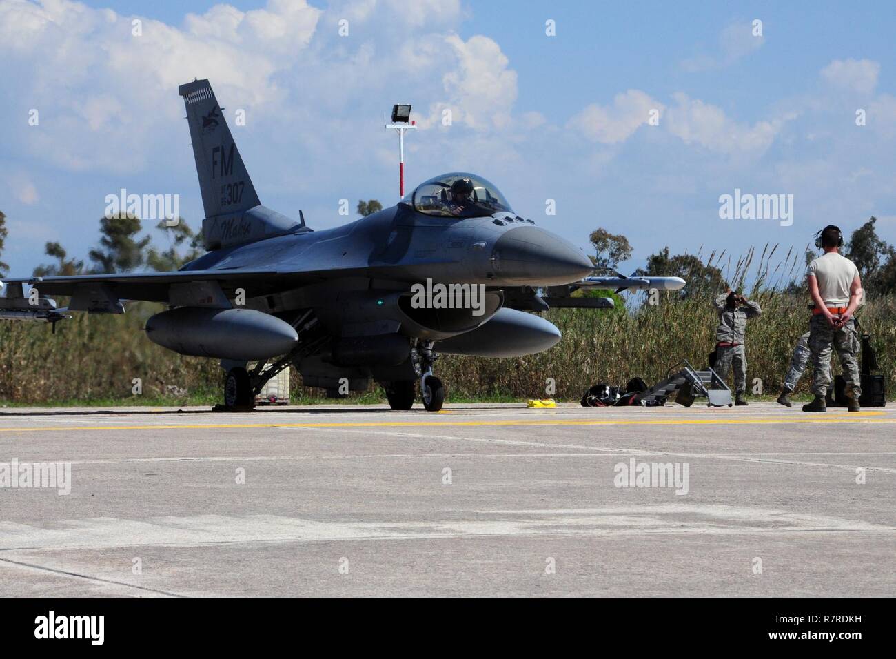 U.S. Air Force Airmen from the 482nd Fighter Wing prepare for a sortie during INIOHOS 17 at Andravida Air Base, Greece, Mar. 28, 2017. Air Guardsmen and Reservists provide critical support throughout the USAFE-AFAFRICA areas of operation by deploying and interacting with a variety of nations. Many Airmen from the 482nd FW are Reservists and this gives them a real-time experience to quickly deploy and re-deploy. Stock Photo