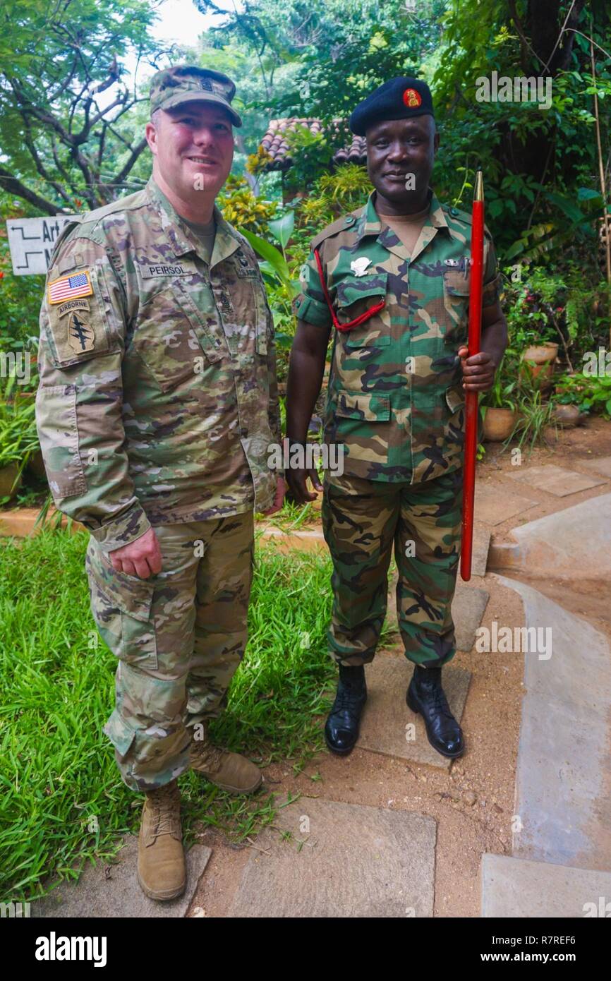 U.S. Army Sgt. Maj. Scott Peirsol, U.S. Army Africa G7 sergeant major, poses with his counterpart from the Malawi Armed Forces at the Malawi Armed Forces College, Salima, Malawi, during the final planning event for the Africa Land Forces Summit 2017, March 28, 2017. ALFS is an annual, weeklong seminar bringing together land force chiefs from across Africa for candid dialog to discuss and develop cooperative solutions to regional and trans-regional challenges and threats. Stock Photo