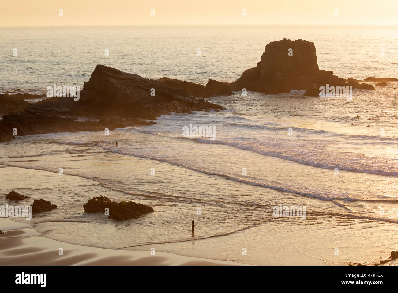 Atlantic sea waves breaking on the beach and rocks at sunset, Zambujeira do Mar, Alentejo region, Portugal, Europe Stock Photo