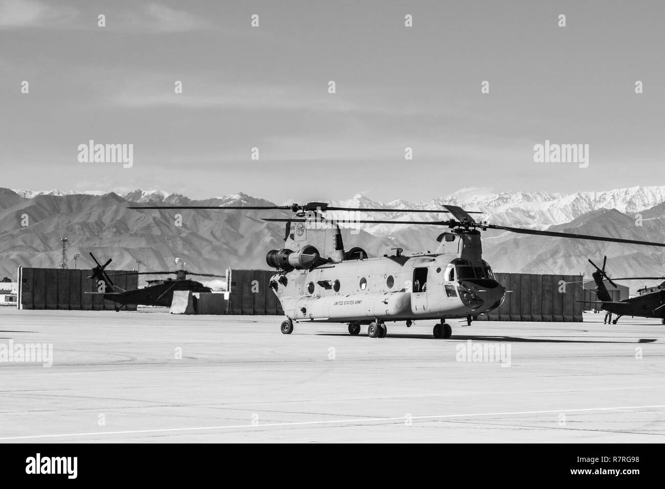 U.S. Army CH-47 helicopter pilots assigned to Task Force Flying Dragon, 16th Combat Aviation Brigade, 7th Infantry Division prepare to depart on a flight carrying U.S. Army Soldiers assigned to 1st Squadron, 14th Cavalry Regiment, 1st Stryker Brigade Combat Team, 2nd Infantry Division during training at Bagram Airfield, Afghanistan, April 1, 2017. The Cavalry troopers provide a ready response force for downed aircraft, and the training focused on preparing them to assume their mission in support of Operation Freedom’s Sentinel and Resolute Support Mission. Stock Photo