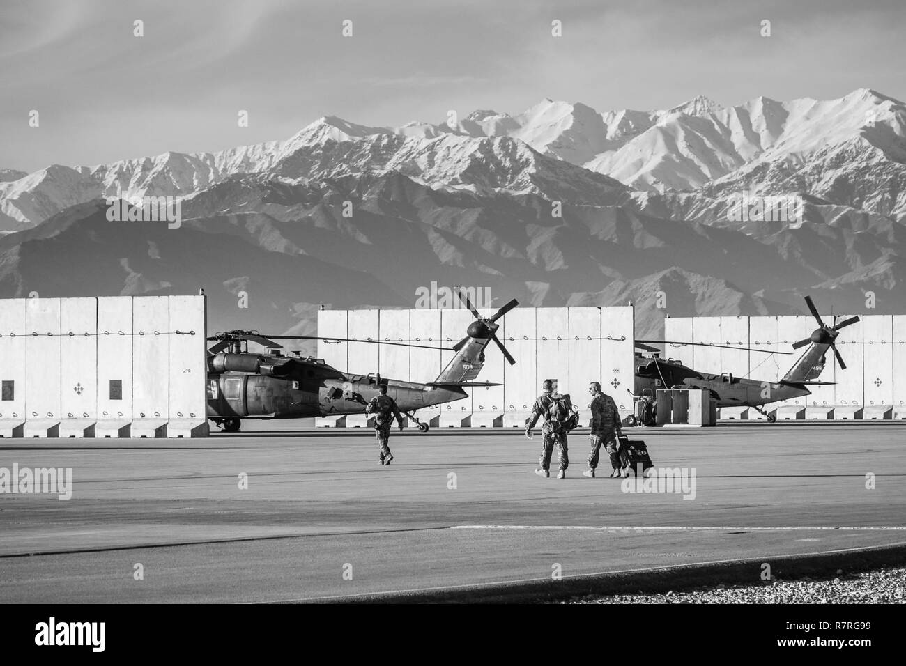 U.S. Army CH-47 helicopter pilots assigned to Task Force Flying Dragon, 16th Combat Aviation Brigade, 7th Infantry Division prepare to depart on a flight carrying U.S. Army Soldiers assigned to 1st Squadron, 14th Cavalry Regiment, 1st Stryker Brigade Combat Team, 2nd Infantry Division during training at Bagram Airfield, Afghanistan, April 1, 2017. The Cavalry troopers provide a ready response force for downed aircraft, and the training focused on preparing them to assume their mission in support of Operation Freedom’s Sentinel and Resolute Support Mission. Stock Photo