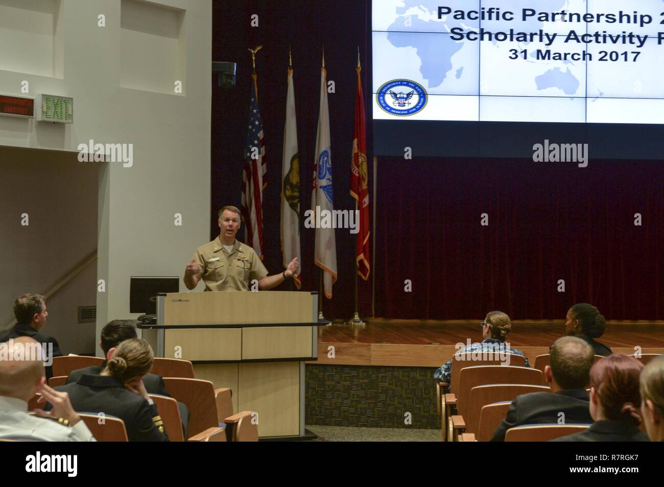SAN DIEGO (Mar. 31, 2017) Capt. Peter Roberts, commanding officer, Medical Treatment Facility, USNS Mercy (T-AH 19), gives his opening remarks at the 2nd annual Pacific Partnership 2016 Scholarly Activity Fair aboard Naval Medical Center San Diego. The Scholarly Activity Fair gave participants a chance to discuss lessons learned during Pacific Partnership, an annual disaster response preparedness mission. Stock Photo