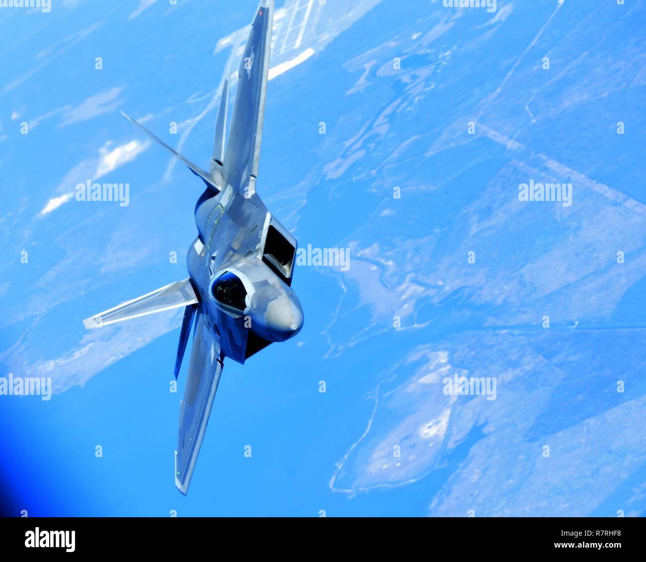 An F-22 Raptor performs aerial maneuvers over the Gulf of Mexico, April ...