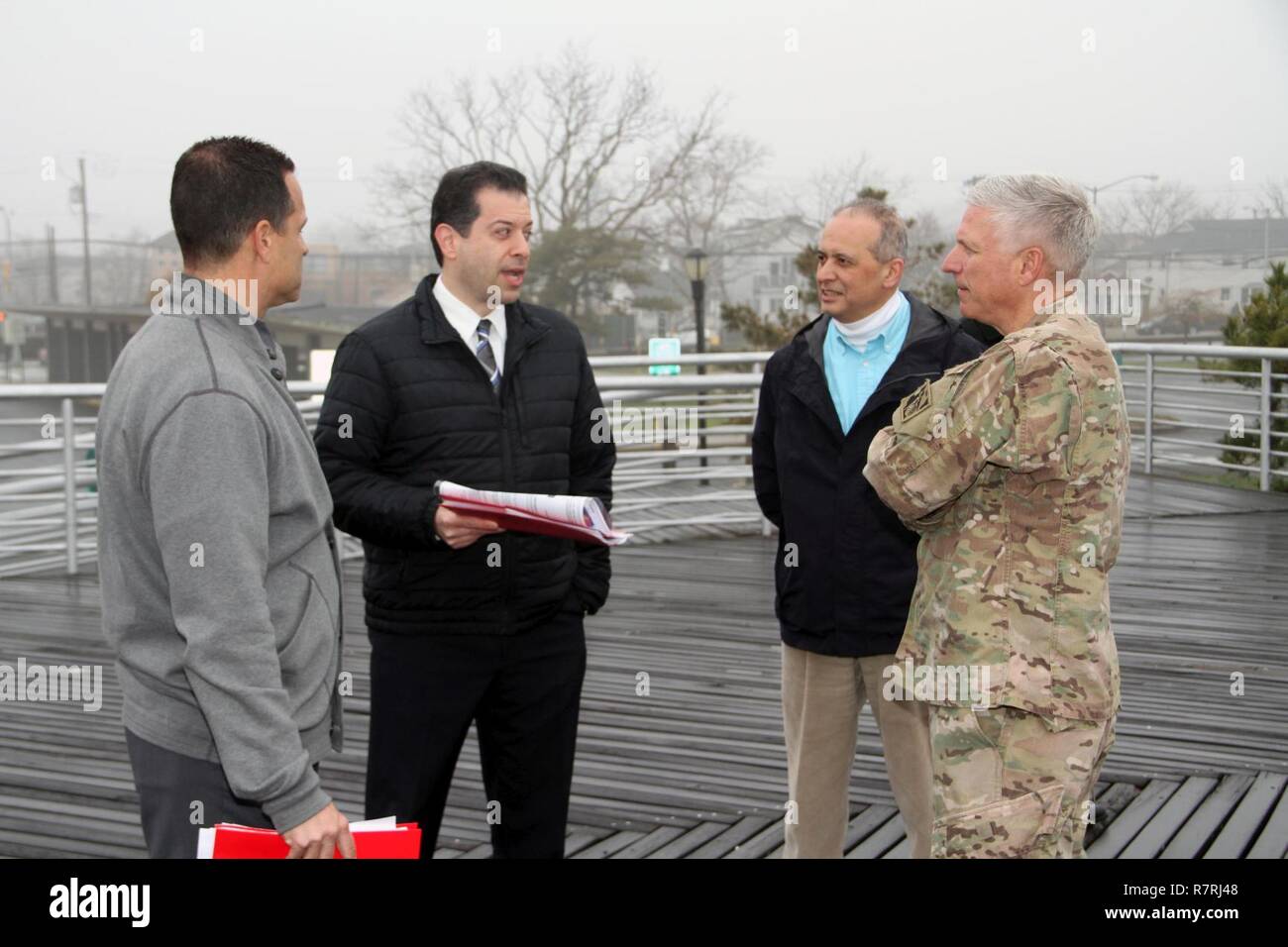 Frank Verga, New York District, U.S. Army Corps of Engineers (second from left), briefs U.S. Army Corps of Engineers Deputy Commanding General Maj. Gen. Rick Stevens (right) on April 4, 2017, describing details about Hurricane Sandy coastal storm risk management work planned for south Staten Island, assisted by Anthony Ciorra (left), also of the New York District. Staten Island, a borough of New York City, suffered significant loss of life and property damage due to Hurricane Sandy's storm surge. Joe Forcina, Chief of the North Atlantic Division's Sandy Coastal Management Division (second from Stock Photo