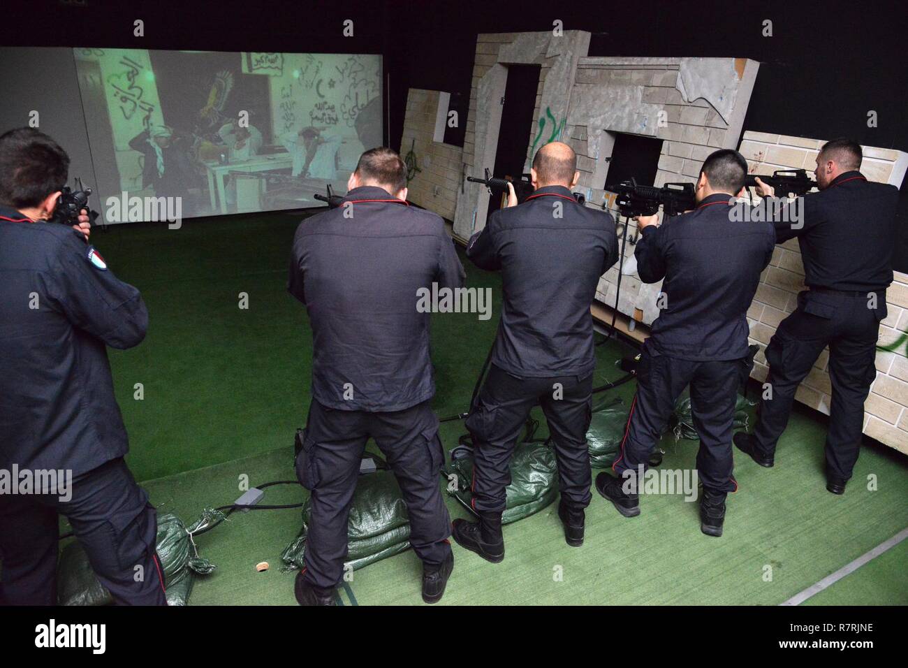 Italian Carabinieri of the 13th Regiment Carabinieri “ Friuli Venezia Giulia” Gorizia, conduct training using Engagement Skills Trainer (EST) at Caserma Ederle Vicenza, Italy, April 3, 2017. Carabinieri use U.S. Army RTSD South equipment to enhance bilateral relations and to expand levels of cooperation and the capacity of the personnel involved in joint operations. Stock Photo