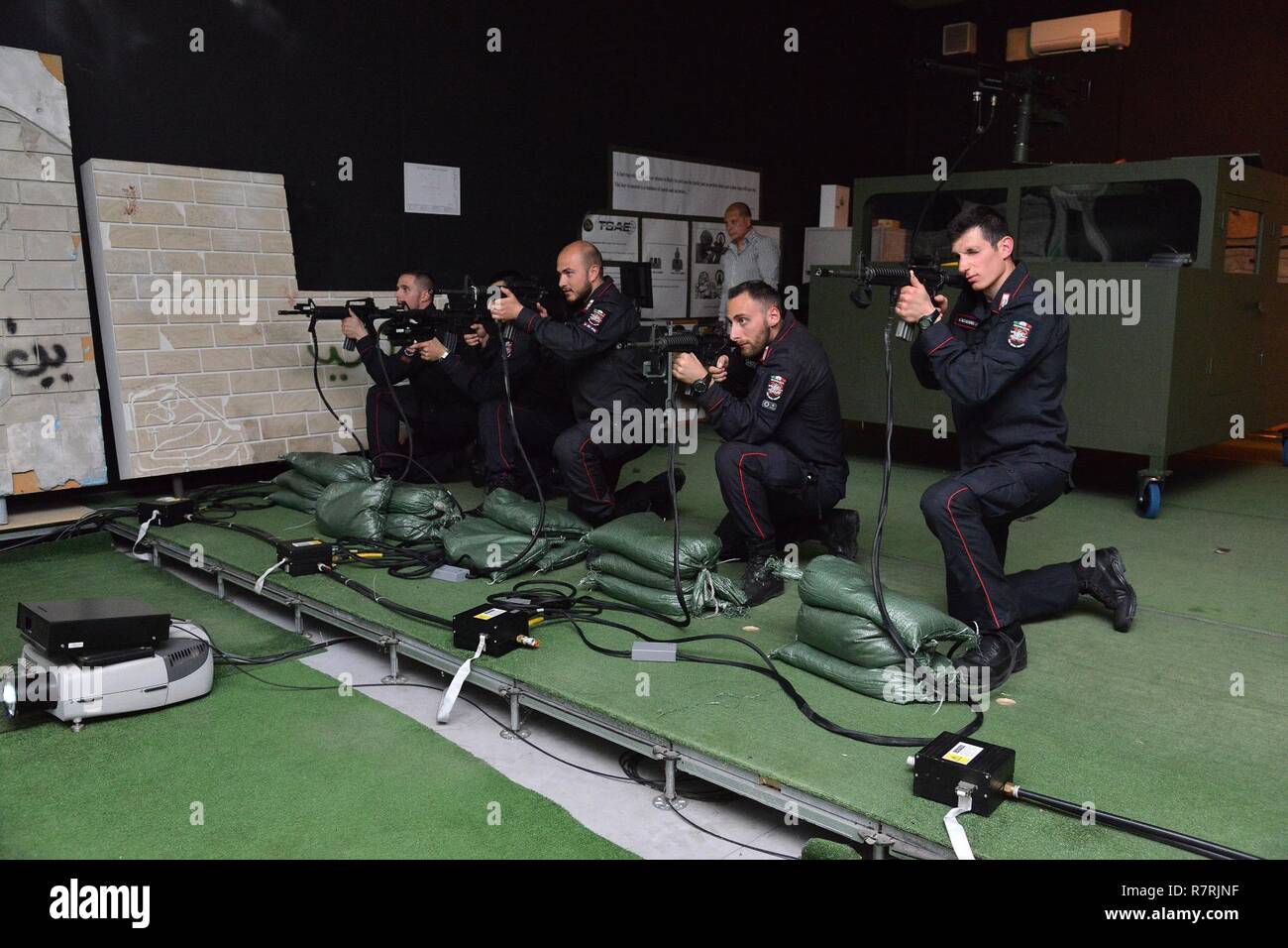 Italian Carabinieri of the 13th Regiment Carabinieri “ Friuli Venezia Giulia”  Gorizia, conduct training using Engagement Skills Trainer (EST) at Caserma Ederle Vicenza, Italy, April 3, 2017. Carabinieri use U.S. Army RTSD South equipment to enhance bilateral relations and to expand levels of cooperation and the capacity of the personnel involved in joint operations. Stock Photo