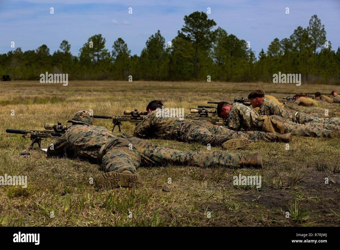 Marines aim and fire M40A6 rifles during an urban sniper course at Camp Lejeune, N.C., March 30, 2017. The Marines practiced engaging targets from unknown distances to maintain their skills on the weapon. The course, taught by Expeditionary Operations Training Group, includes Marines from 2nd Battalion, 6th Marine Regiment, 2nd Reconnaissance Battalion and School of Infantry-East. Stock Photo