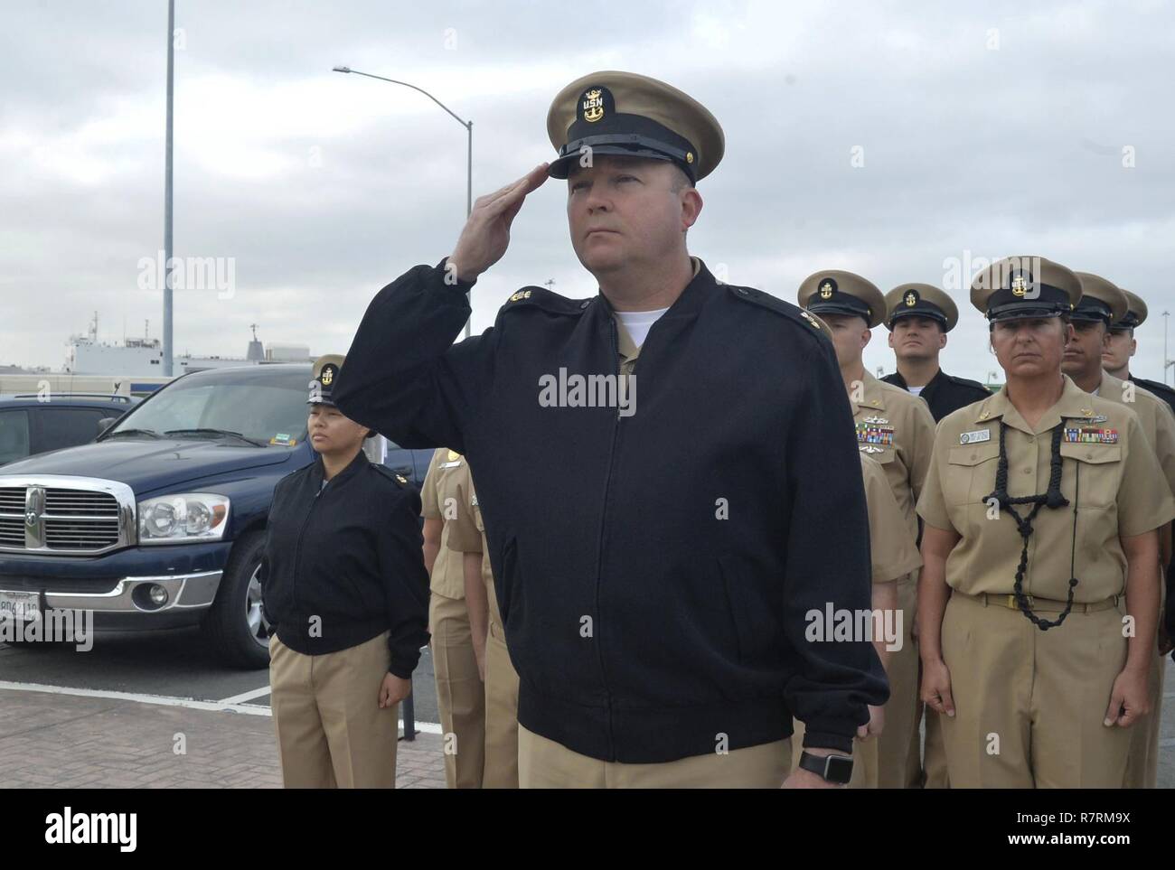 SAN DIEGO (April 3, 2017) Naval Base San Diego Command Master Chief Matt Ruane along with the Chief’s Mess observe morning colors in celebration of the 124th birthday of the chief petty officer rank. Stock Photo