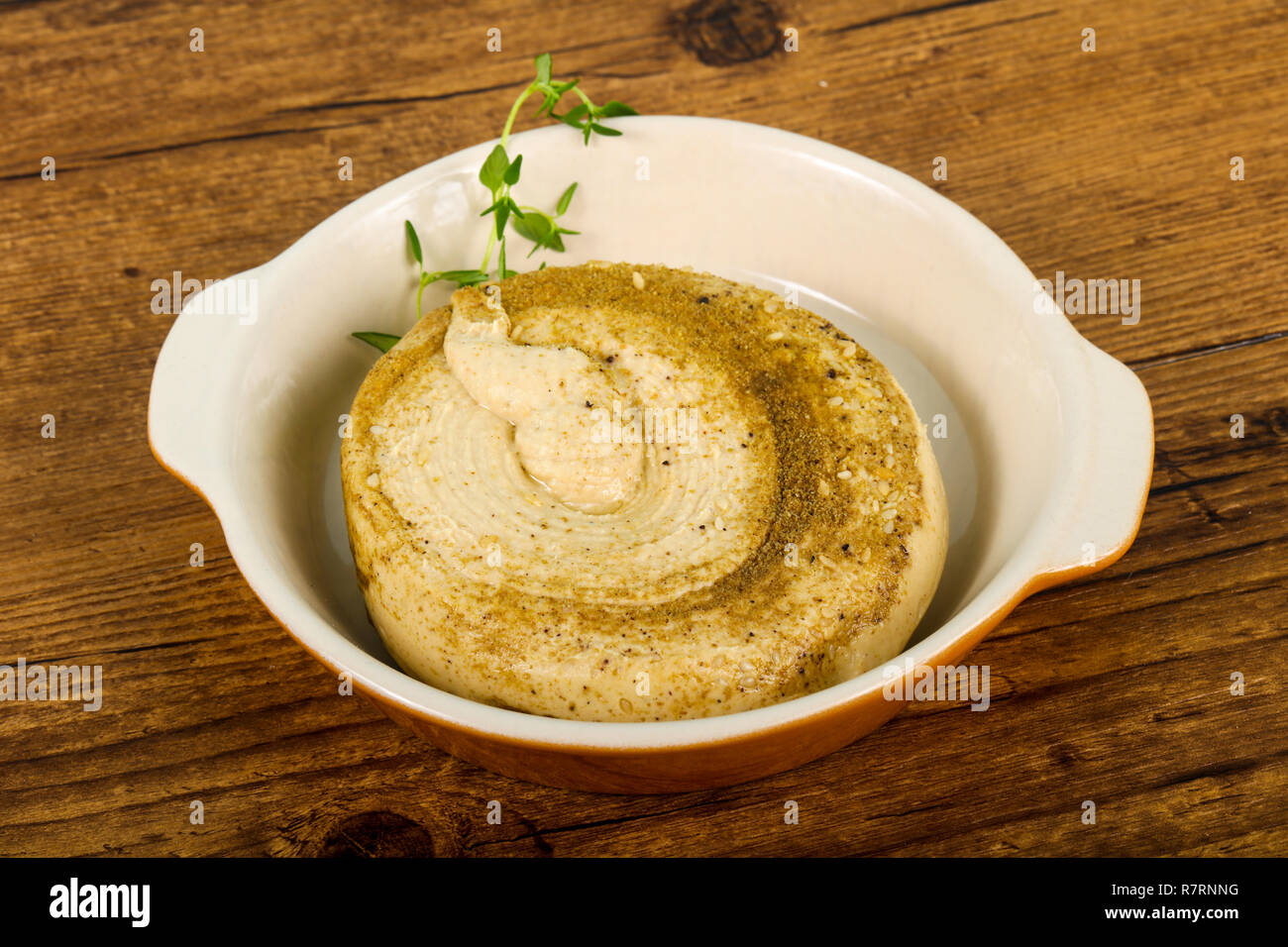 Vegetarian Humus with sesame seeds and thyme leaves Stock Photo Alamy