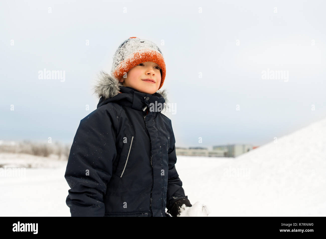 happy little boy in winter clothes outdoors Stock Photo Alamy