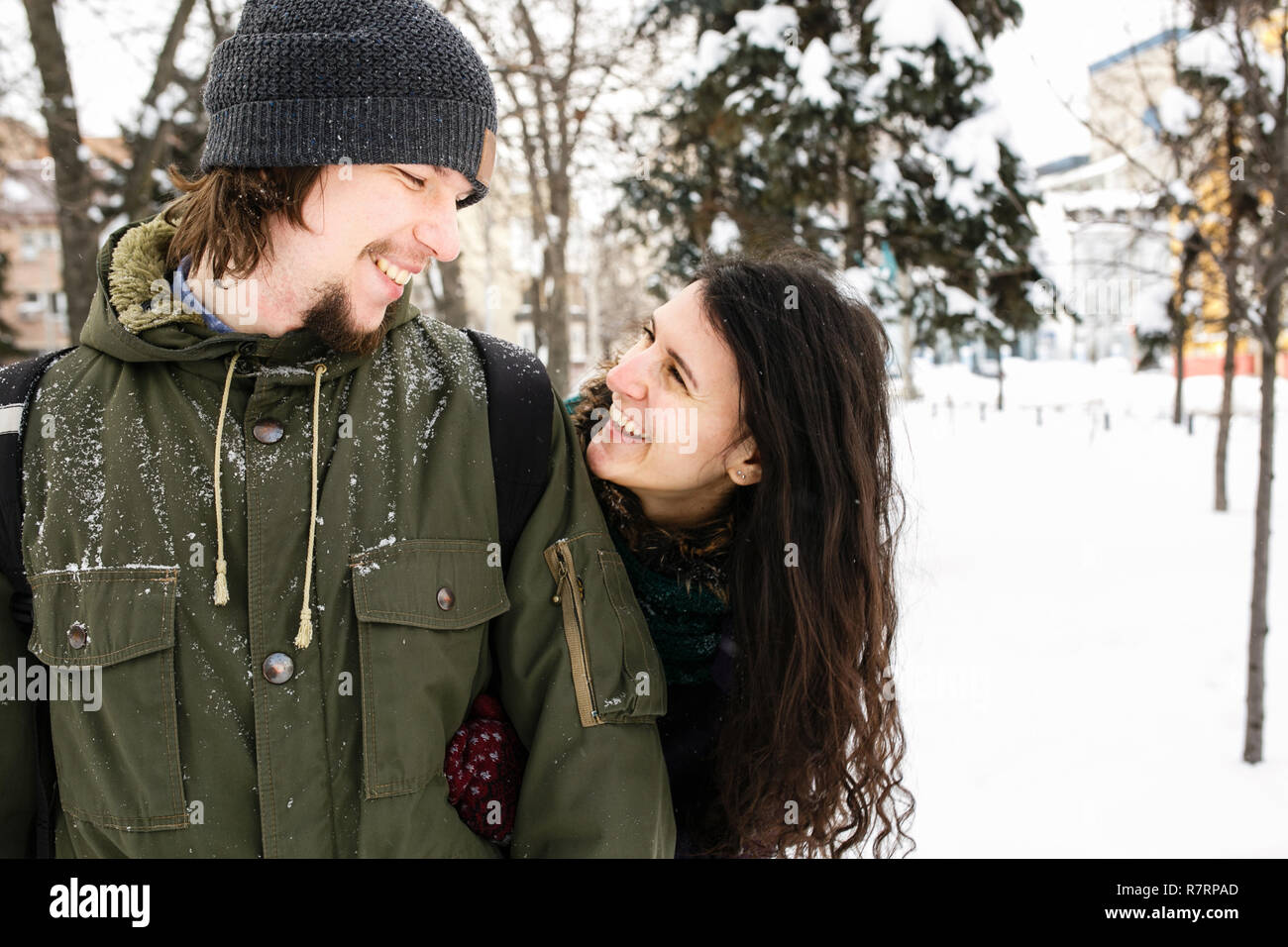 Happy Young in love Couple in Winter Park having fun Stock Photo - Alamy