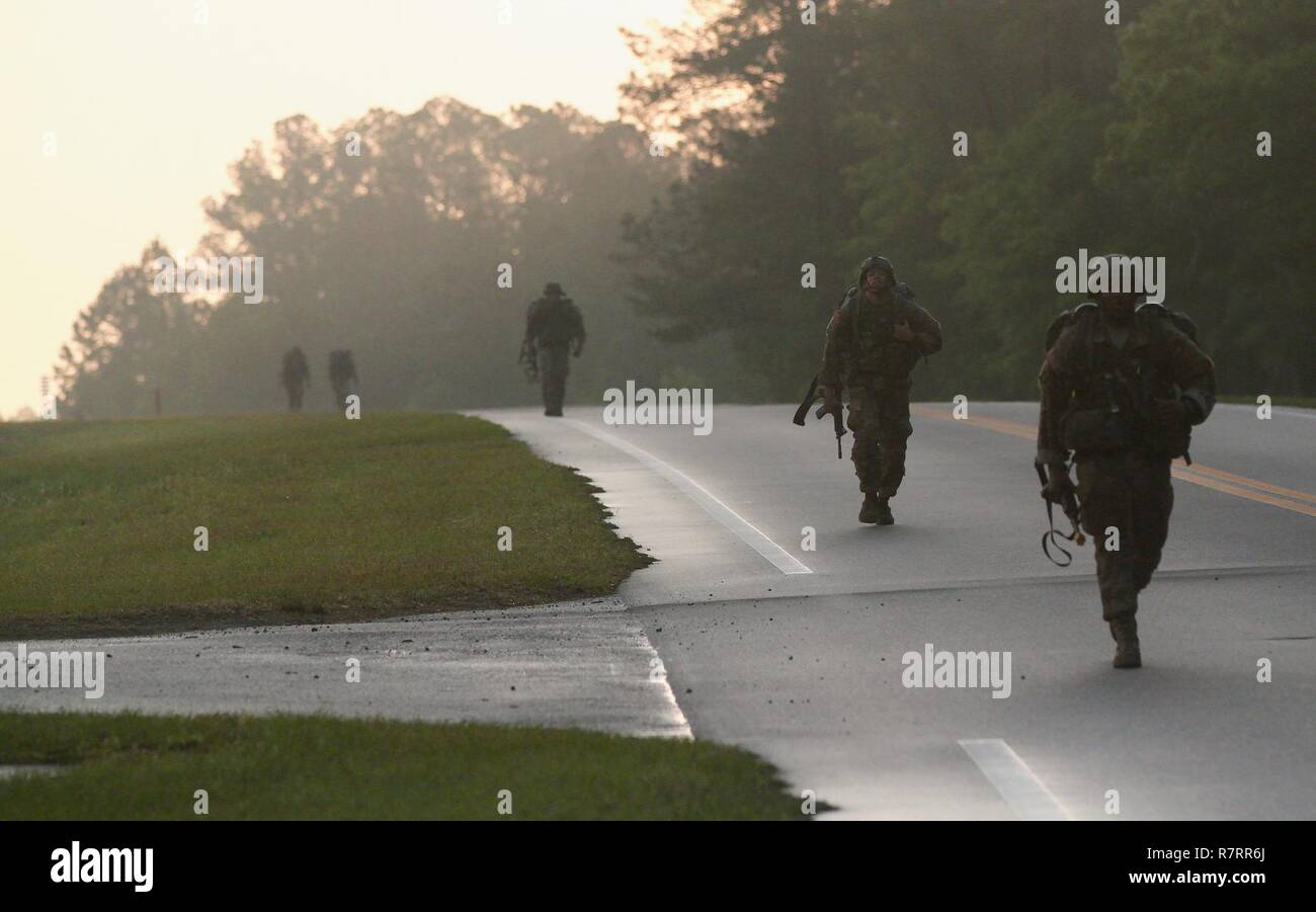 U.S. Army National Guard Soldiers from the 2nd Battalion, 124th Infantry in the midst of a challenging 12-mile ruck march for the Expert Infantryman Badge qualification course at Camp Blanding Training Center, Starke, Fla. on April 6th, 2017. The ruck march has a time limit of 3 hours to complete. Stock Photo