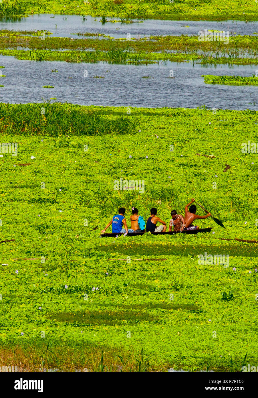 People in a pirogue at Iquitos,Amazon Peru Stock Photo