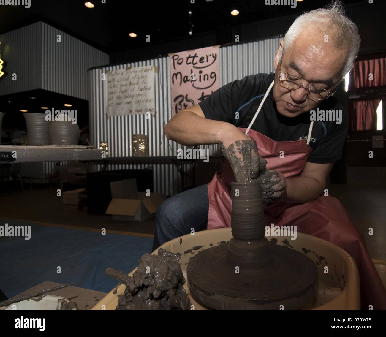 Hide Chika, an Aomori potter, creates a ceramic cup during the 30th Annual Japan Day at Misawa Air Base, Japan, April 8, 2017. Along with pottery, attendees partook in creating Japanese kites, embroidery and origami crafts with the local community. Stock Photo