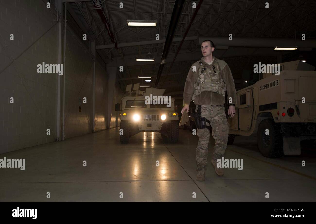 Senior Airman Michael Ripple, 791st Missile Security Forces Squadron response force leader, guides a Humvee at Minot Air Force Base, N.D., Mar. 28, 2017. Inspections are done by the Airmen checking out a vehicle for use. Stock Photo