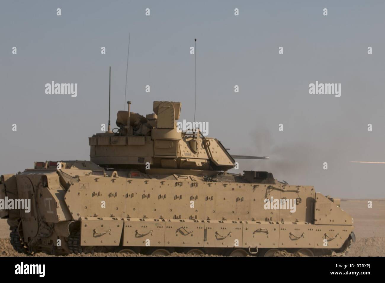 A 3rd Armored Brigade Combat Team, 1st Cavalry Division M2A3 Bradley Fighting Vehicle shoots at targets during the brigade's Table VI qualfications at the Udairi Range Complex March 27. The brigade tank and Bradley crews spent about two weeks in the field conducting sustainment gunnery to ensure all the crews qualified at day and night fire to maintain proficiency. Stock Photo