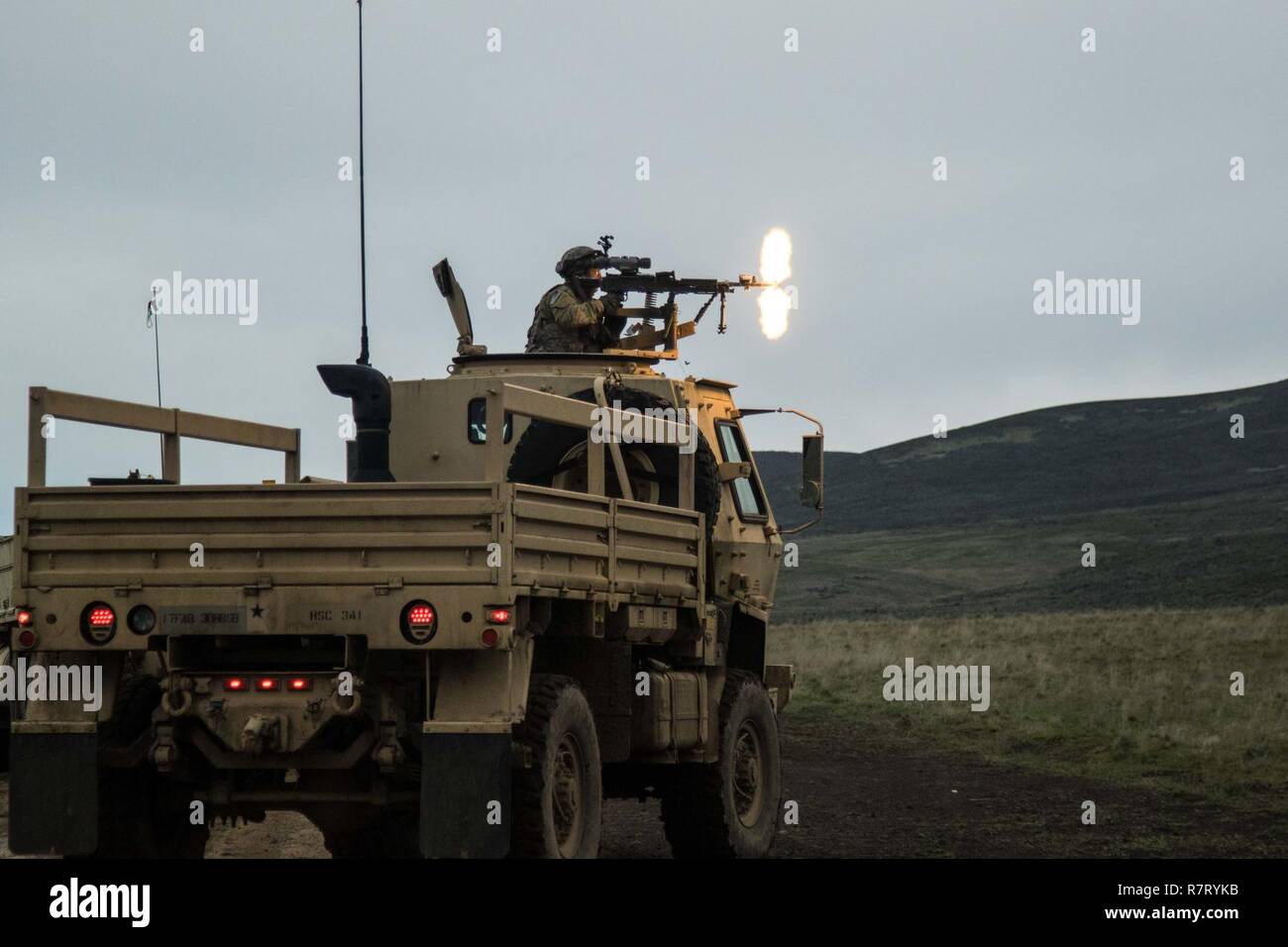 308th Brigade Support Battalion, 17th Field Artillery Brigade soldier lays down suppressive fire during a platoon training evaluation at Yakima Training Center, Wash., April 8, 2017. 308th BSB is at YTC to conduct evaluations on how well the soldiers are being trained on their combat operation tasks. Stock Photo