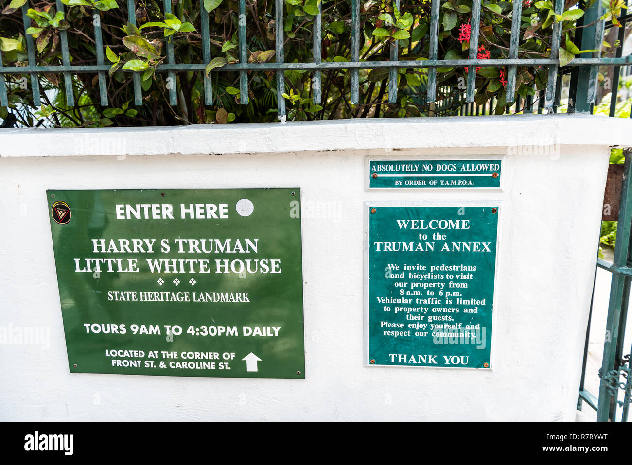 Key West, USA - May 1, 2018: Harry Truman little white house historic landmark on street architecture with tourist information sign closeup in Florida Stock Photo
