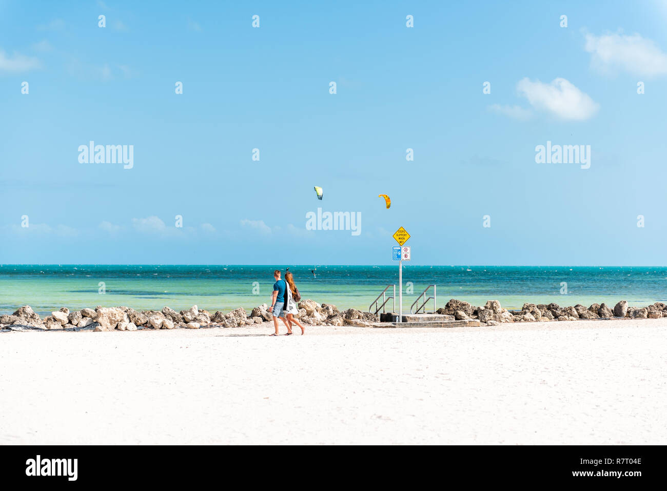 Key West, USA May 1, 2018 People walking by pier park with man
