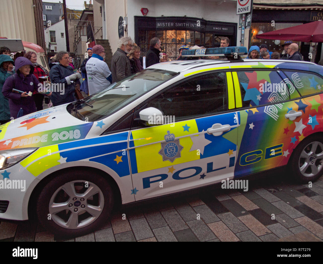A Brighton police car adorned with the colors and motifs of Gay Pride Stock Photo
