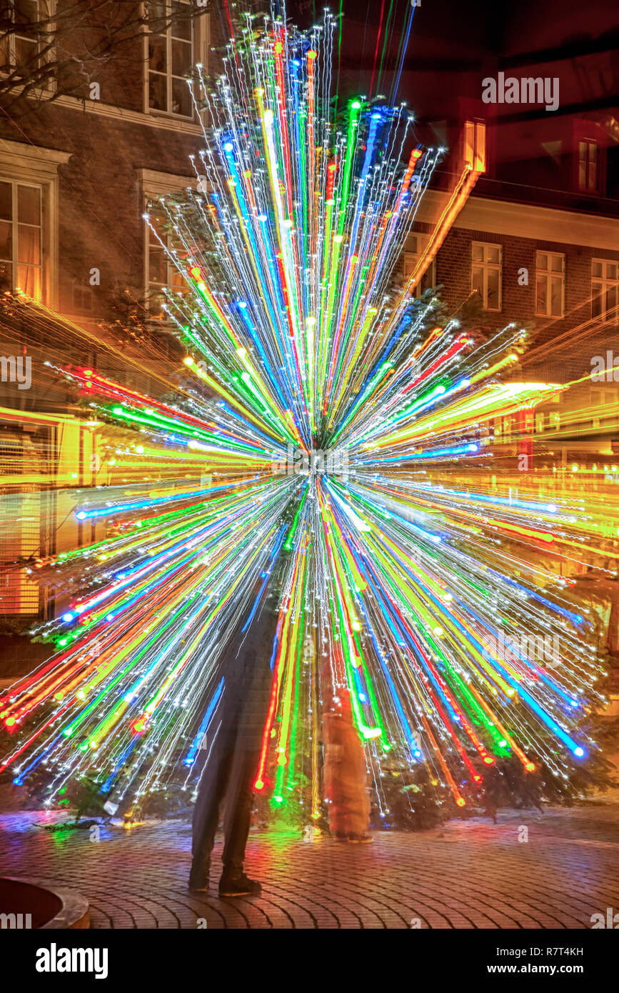 A zoom effect on a christmas tree whilst taken a long exposure photo. Stock Photo