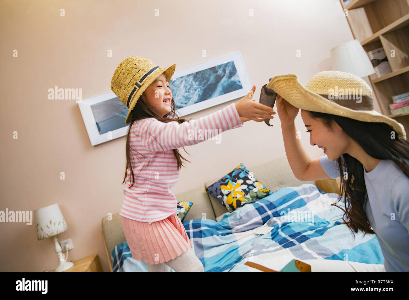 Mother and daughter playing in the bedroom Stock Photo Alamy