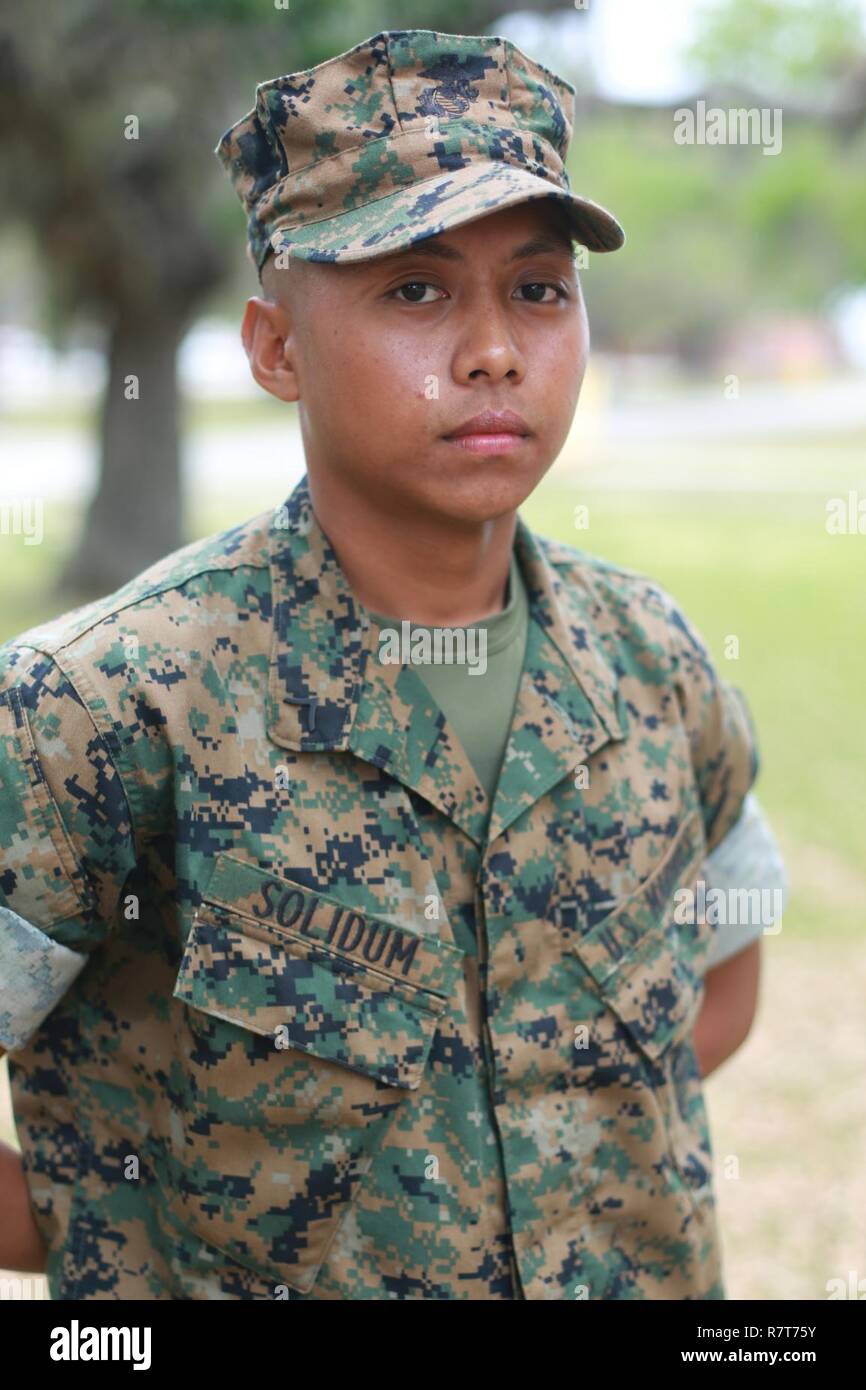 Pfc. Ivar Therd D. Solidum, Platoon 1021, Alpha Company, 1st Recruit Training Battalion, earned U.S. citizenship 42831, on Parris Island, S.C. Before earning citizenship, applicants must demonstrate knowledge of the English language and American government, show good moral character and take the Oath of Allegiance to the U.S. Constitution. Solidum, from Long Island, N.Y., originally from Philippines, is scheduled to graduate 42829. Stock Photo