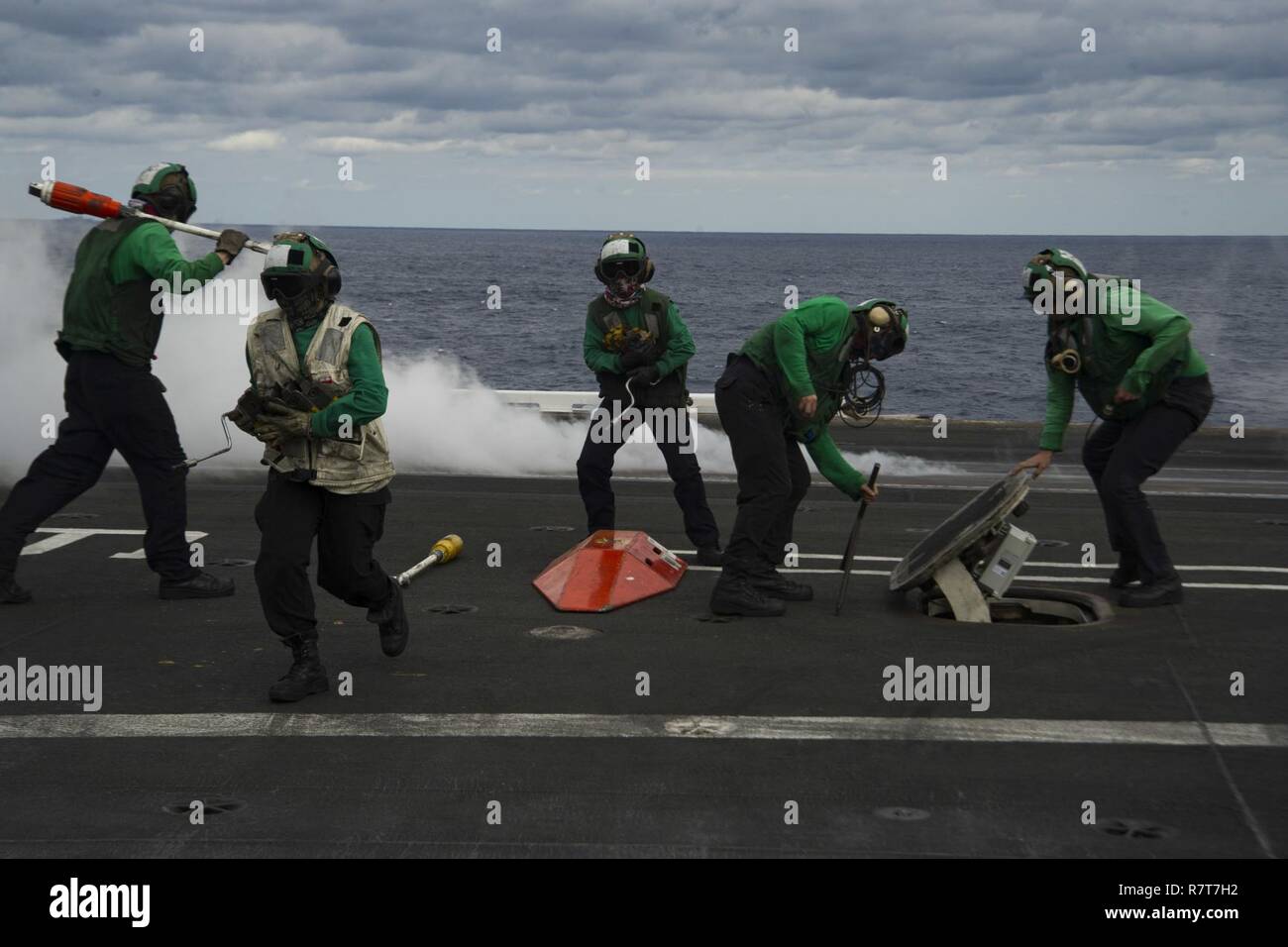 ATLANTIC OCEAN (April 3, 2017) Sailors prepare the flight deck for aircraft recovery during cyclic flight operations aboard the aircraft carrier USS Dwight D. Eisenhower (CVN 69). The ship and its carrier strike group are underway conducting a sustainment exercise in support of the Optimized Fleet Response Plan (OFRP). Stock Photo