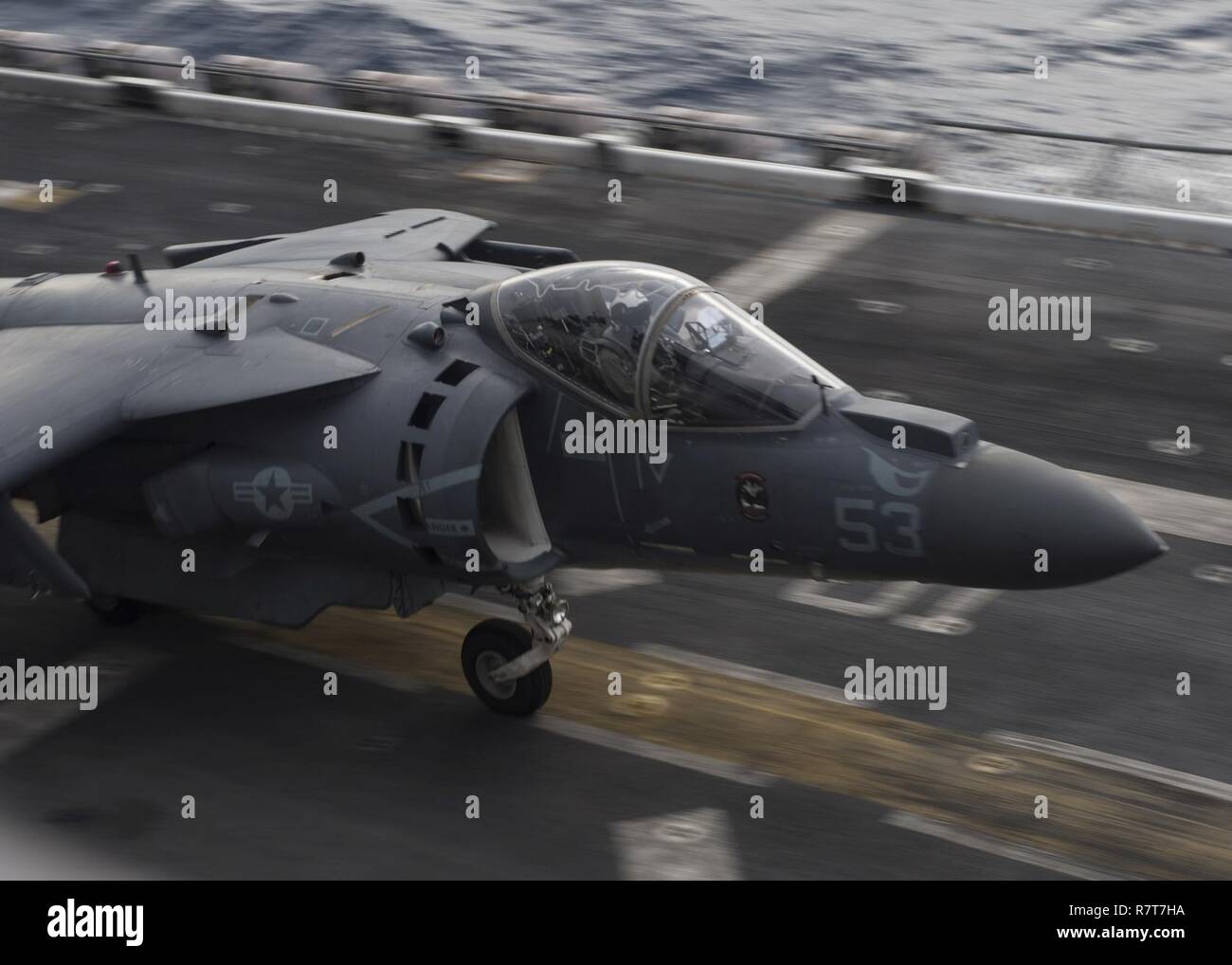 SOUTH CHINA SEA (April 4, 2017) An AV-8B Harrier assigned to the “Ridge Runners” of Marine Medium Tiltrotor Squadron (VMM) 163 launches from the flight deck of the amphibious assault ship USS Makin Island (LHD 8). Makin Island, the flagship for the Makin Island Amphibious Ready Group, with the embarked 11th Marine Expeditionary Unit (11th MEU), is operating in the Indo-Asia-Pacific region to enhance amphibious capability with regional partners and to serve as a ready-response force for any type of contingency. Stock Photo