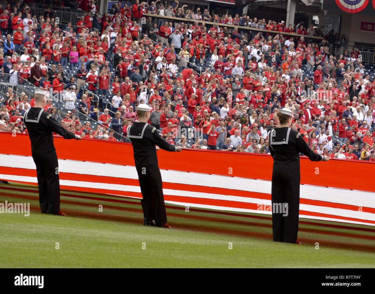 WASHINGTON (April. 3, 2017) Sailors assigned to the U.S. Navy Ceremonial Guard take part in an opening day ceremony during a Washington Nationals baseball game. Stock Photo