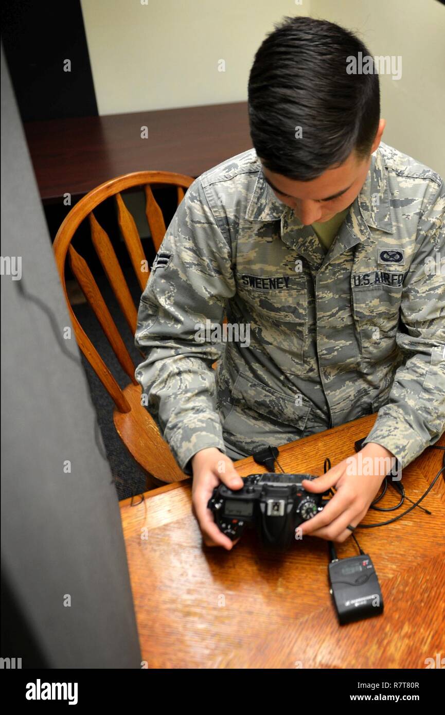 U.S. Air Force Airman 1st Class Seán Sweeney, 20th Fighter Wing (FW) Public Affairs (PA) broadcast journalist journeyman, monitors audio levels before recording a promotional radio announcement at the 20th FW PA office at Shaw Air Force Base, S.C., March 21, 2017. Broadcast journalists communicate through the use of audiovisual productions, intended to inform and educate local and military outlets about base operations, while preserving Air Force history. Stock Photo