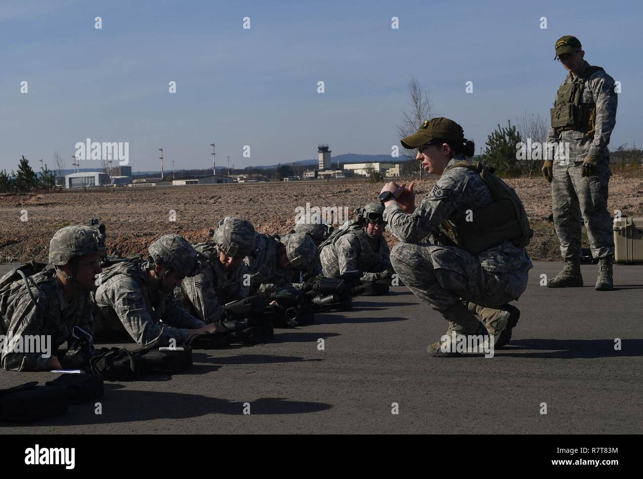 Staff Sgt. Kelsea Ashmore, 435th Security Forces Squadron’s Ground Combat Readiness Training Center instructor, expalins to students of the Security Operations Course how to estimate the distance of target during the range estimation portion of the course on Ramstein Air Base, Germany, March 25, 2017. The purpose of the two-week course is to prepare security forces Airmen who are deploying down range. Airmen assigned to the 86th SFS, 422nd SFS, 100th SFS, and 569th U.S. Forces Police Squadron participated in the course. Stock Photo