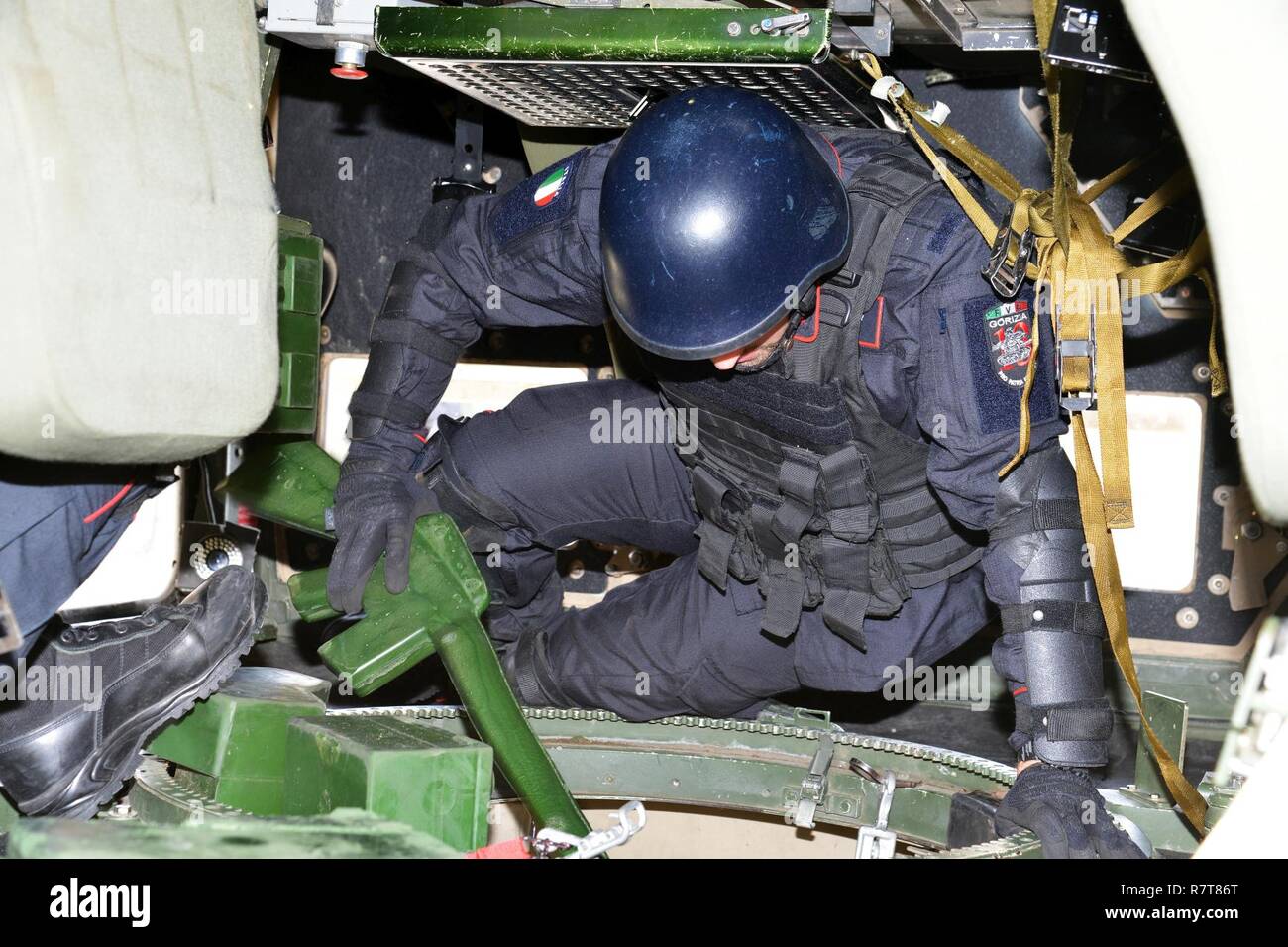 Italian Carabinieri of the 7th Regiment Carabinieri “Laives” Bolzano and 13th Regiment Carabinieri “Friuli Venezia Giulia” Gorizia conduct training using the High Mobility Multipurpose Wheeled Vehicle (HMMWV) egress assistance trainer (HEAT), at Caserma Ederle Vicenza, Italy, April 6, 2017. The simulator allows soldiers to practice exit from vehicles, skills and engage in realistic scenarios. Carabinieri use U.S. Army RTSD South equipment to enhance the bilateral relations and to expand levels of cooperation and the capacity of the personnel involved in joint operations. Stock Photo