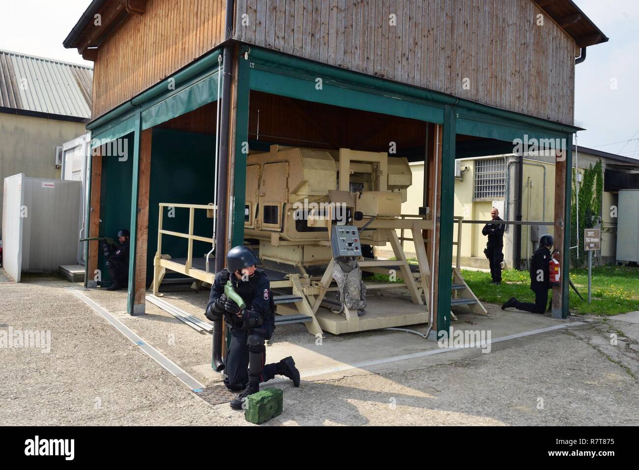 Italian Carabinieri of the 7th Regiment Carabinieri “Laives” Bolzano and 13th Regiment Carabinieri “Friuli Venezia Giulia” Gorizia conduct training using the High Mobility Multipurpose Wheeled Vehicle (HMMWV) egress assistance trainer (HEAT), at Caserma Ederle Vicenza, Italy, April 6, 2017. The simulator allows soldiers to practice exit from vehicles, skills and engage in realistic scenarios. Carabinieri use U.S. Army RTSD South equipment to enhance the bilateral relations and to expand levels of cooperation and the capacity of the personnel involved in joint operations. Stock Photo