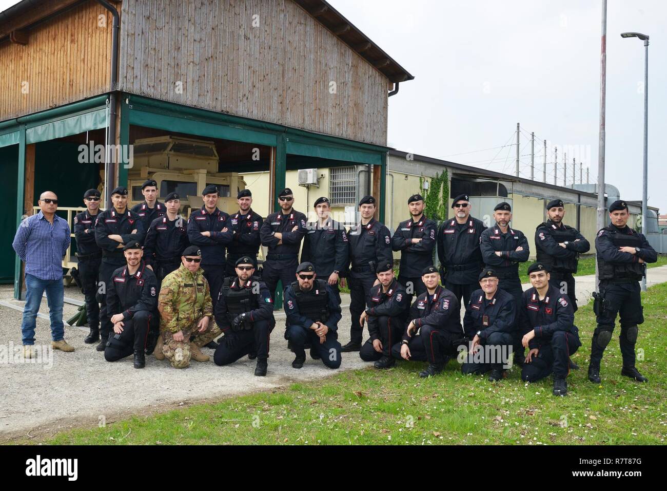Italian Carabinieri of the 7th Regiment Carabinieri “Laives” Bolzano and 13th Regiment Carabinieri “Friuli Venezia Giulia” Gorizia, pose for a group photo, during the training at Caserma Ederle Vicenza, Italy, April 6, 2017. Carabinieri use U.S. Army RTSD South equipment to enhance the bilateral relations and to expand levels of cooperation and the capacity of the personnel involved in joint operations. Stock Photo