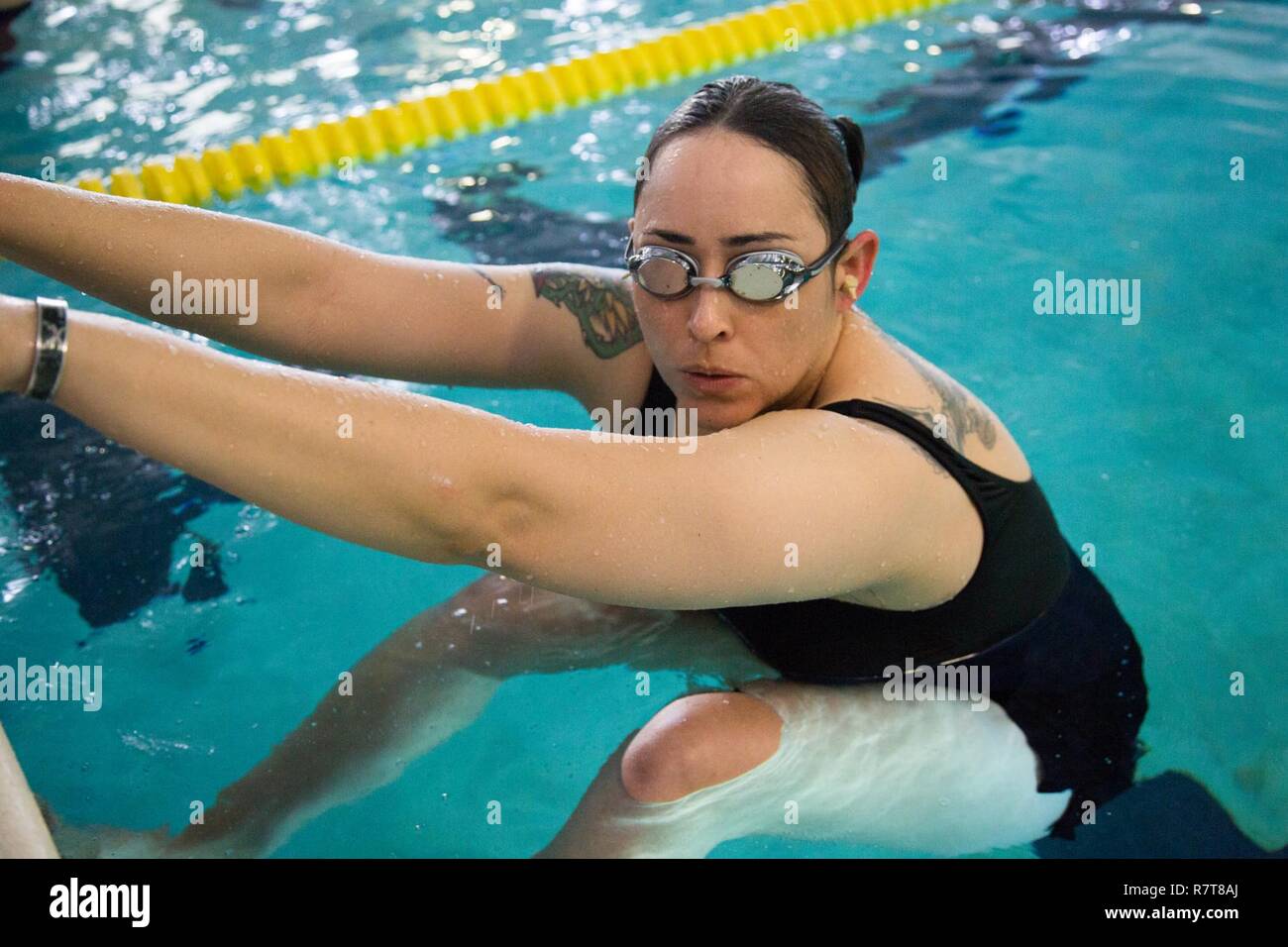 U.S. Army Sgt. Karla Caldera, Ft. Belvoir, Va., competes in the swimming event for the Warrior Care and Transition's Army Trials at Fort Bliss, Texas, April 6, 2017. About 80 wounded, ill and injured active-duty Soldiers and veterans are competing in eight different sports 2-6 April for the opportunity to represent Team Army at the 2017 Department of Defense Warrior Games. Stock Photo