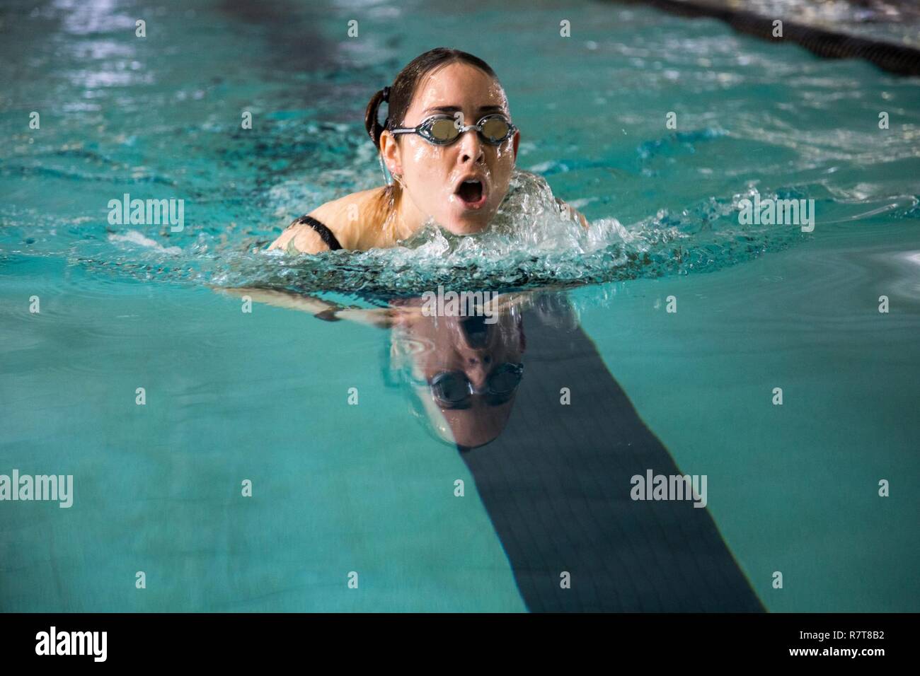 U.S. Army Sgt. Karla Caldera, Ft. Belvoir, Va., competes in the swimming event for the Warrior Care and Transition's Army Trials at Fort Bliss, Texas, April 6, 2017. About 80 wounded, ill and injured active-duty Soldiers and veterans are competing in eight different sports 2-6 April for the opportunity to represent Team Army at the 2017 Department of Defense Warrior Games. Stock Photo