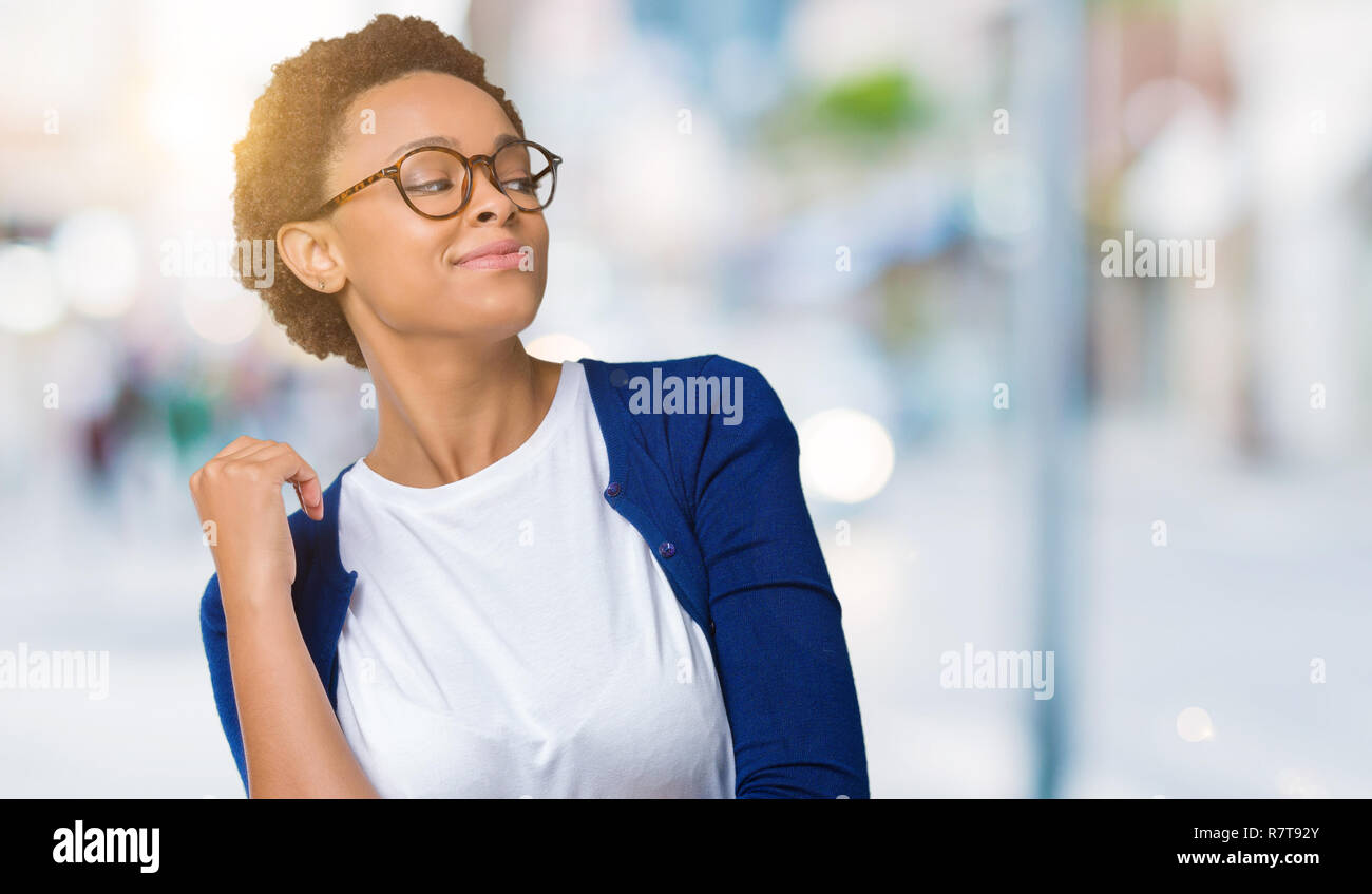 Young beautiful african american woman wearing glasses over isolated ...
