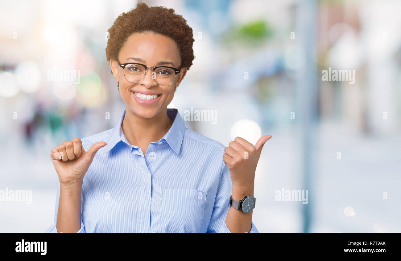 Young beautiful african american business woman over isolated ...