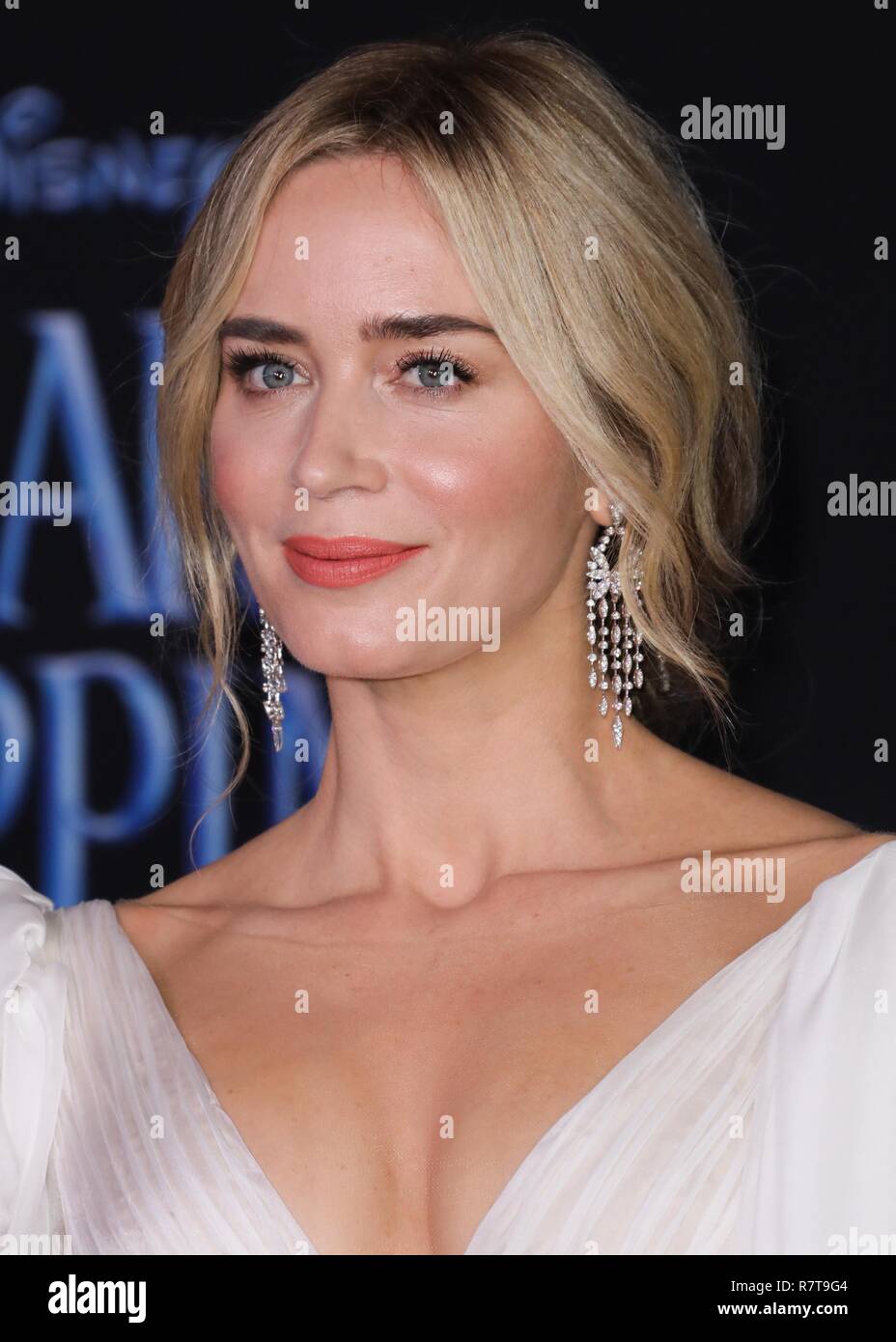 HOLLYWOOD, LOS ANGELES, CA, USA - NOVEMBER 29: Actress Emily Blunt wearing a Yanina Couture dress, Loriblu shoes, a Judith Leiber clutch, and Stephen Webster jewelry arrives at the World Premiere Of Disney's 'Mary Poppins Returns' held at the El Capitan Theatre on November 29, 2018 in Hollywood, Los Angeles, California, United States. (Photo by David Acosta/Image Press Agency) Stock Photo