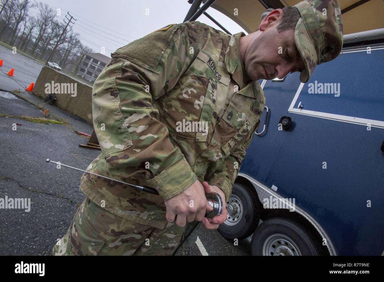 Sgt. 1st Class Steve B. Kovacs with the New Jersey National Guard's 21st Weapons of Mass Destruction-Civil Support Team, assembles a communications antenna during a joint training exercise with members of the Monmouth County Hazmat team at Fort Monmouth, N.J., April 6, 2017. The 21st WMD-CST is a joint unit comprised of New Jersey National Guard Soldiers and Airmen whose mission is to support civil authorities by identifying chemical, biological, radiological, and nuclear substances in either man-made or natural disasters. (New Jersey National Guard Stock Photo
