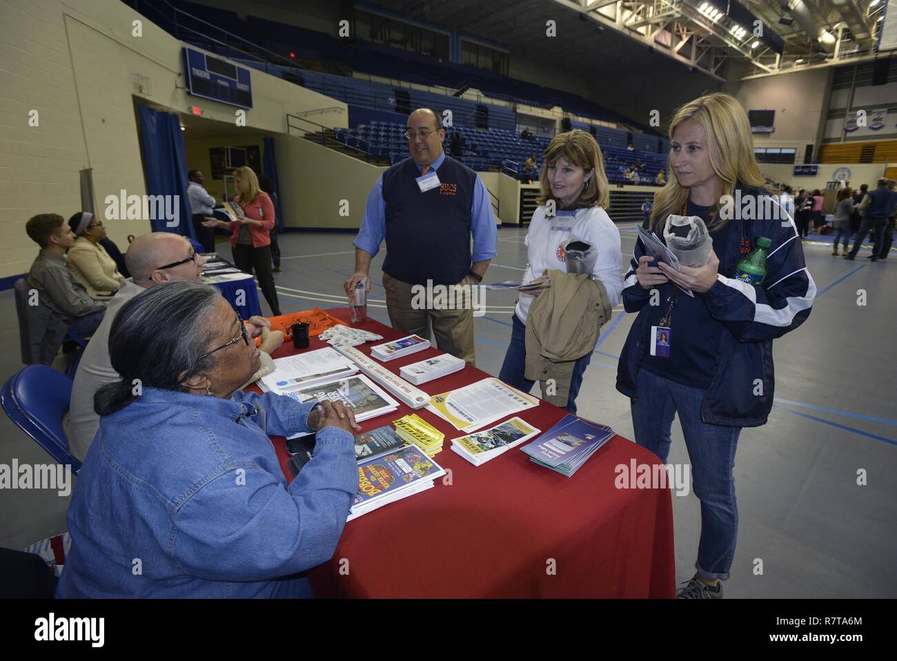 Carol Haynes, Equal Employment Office chief, and David Claussen, EEO specialist talk to STEM 6th grade science teachers (Left to right) Manny Lopez, Teresa Bess and Tabitha Fitz-Wilson from T. W. Hunter Middle School during the Science, Technology, Engineering and Mathematics Expo at Tennessee State University Gentry Center April 6, 2017. Stock Photo