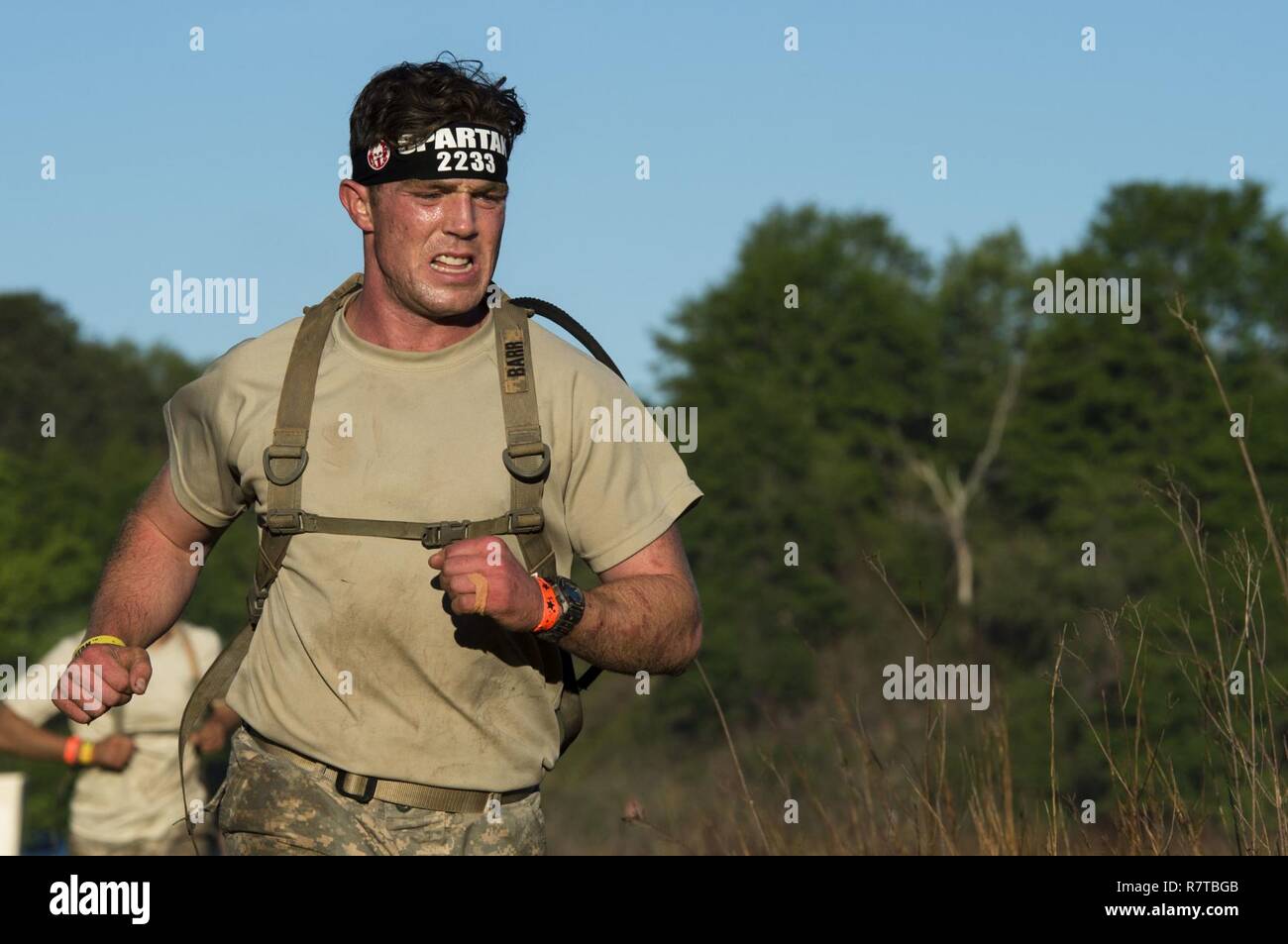 U.S Army Rangers run in a Spartan Race during the Best Ranger Competition 2017 at Fort Mitchell, Ala., April 8, 2017. The 34th annual David E. Grange Jr. Best Ranger Competition 2017 is a three-day event consisting of challenges to test competitor's physical, mental, and technical capabilities. Stock Photo