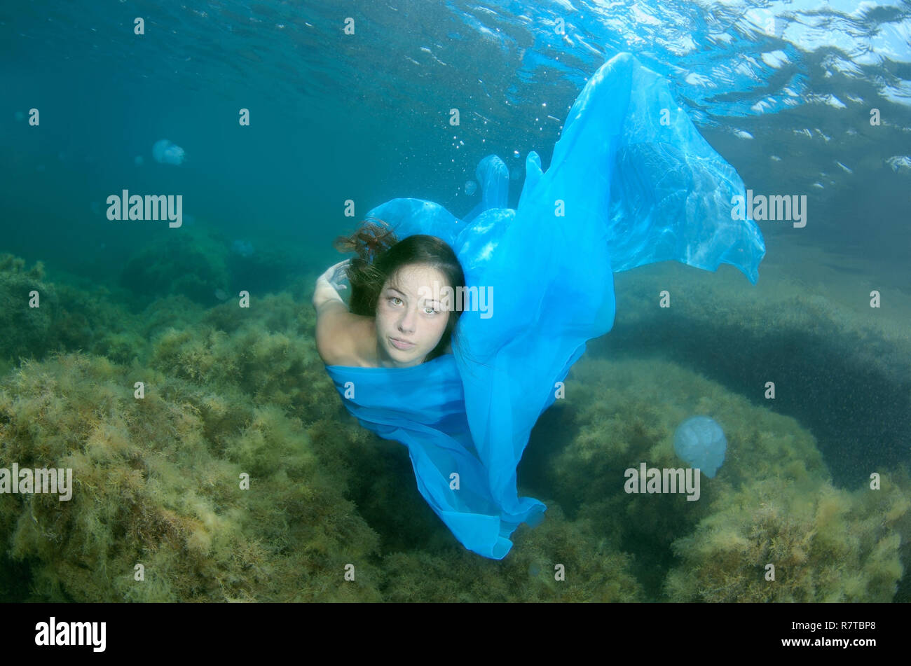 Woman presenting underwater fashion, Black Sea, Crimea, Ukraine Stock Photo