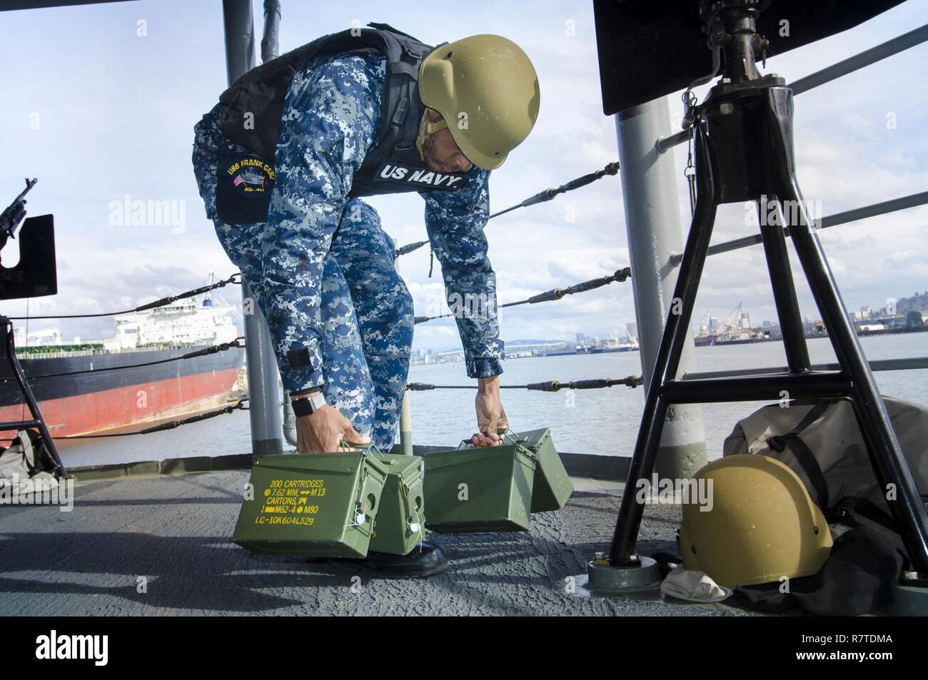 PORTLAND, Ore. (April 6, 2017) - Boatswain's Mate 3rd Class Brandon Elliott, a native of Sanford, N.C. and assigned to the submarine tender USS Frank Cable (AS 40), secures the weapons watch from sea and anchor, after transiting the Columbia River to Portland, Ore., April 6. Frank Cable is in Portland, Ore. for a scheduled dry-dock phase maintenance availability. Stock Photo